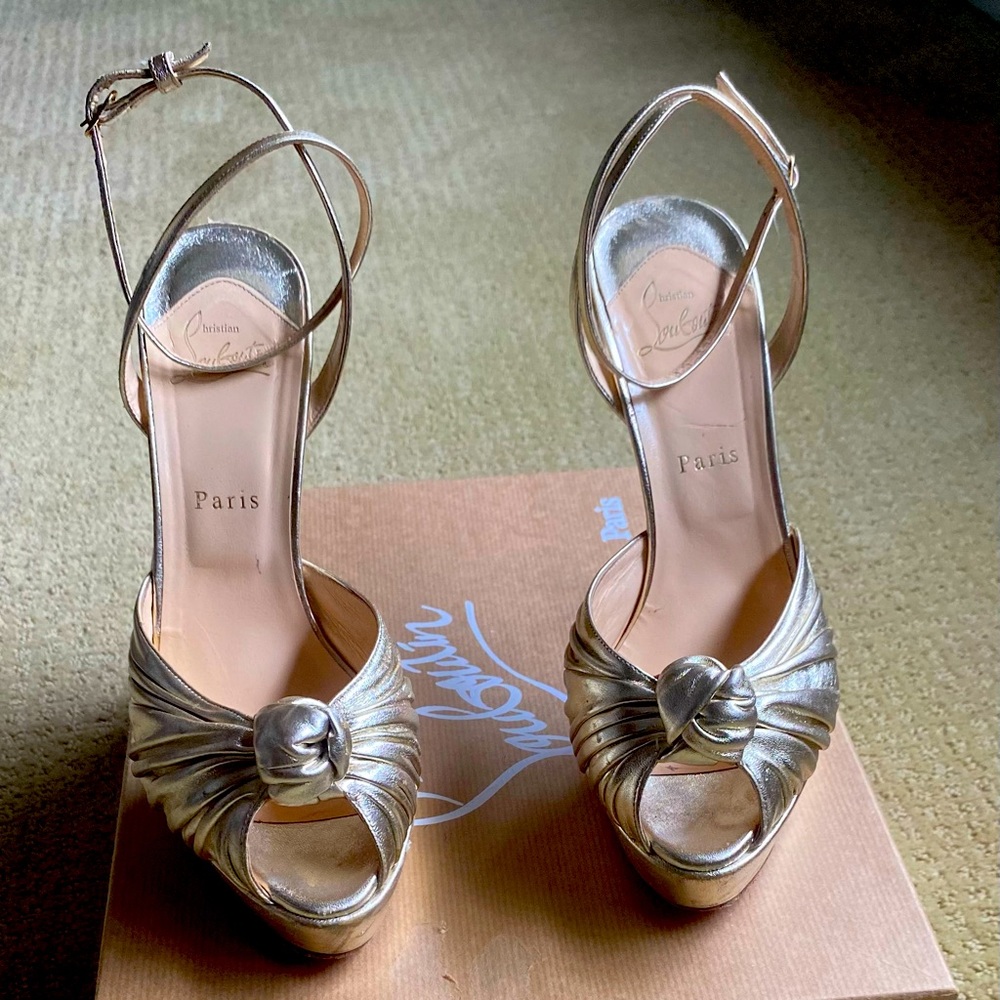 Christian Louboutin gold strappy heels.